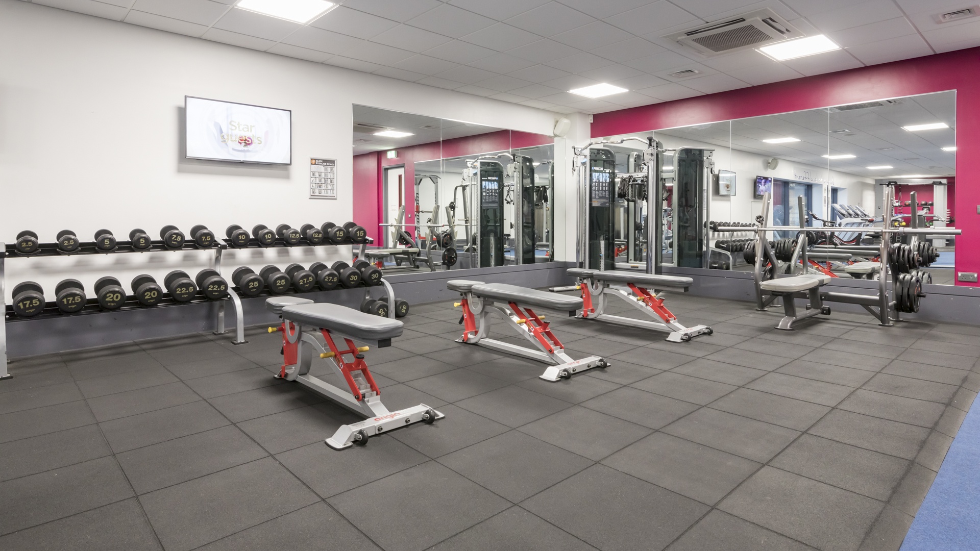 A photo of benches and weights at 3D Health & Fitness