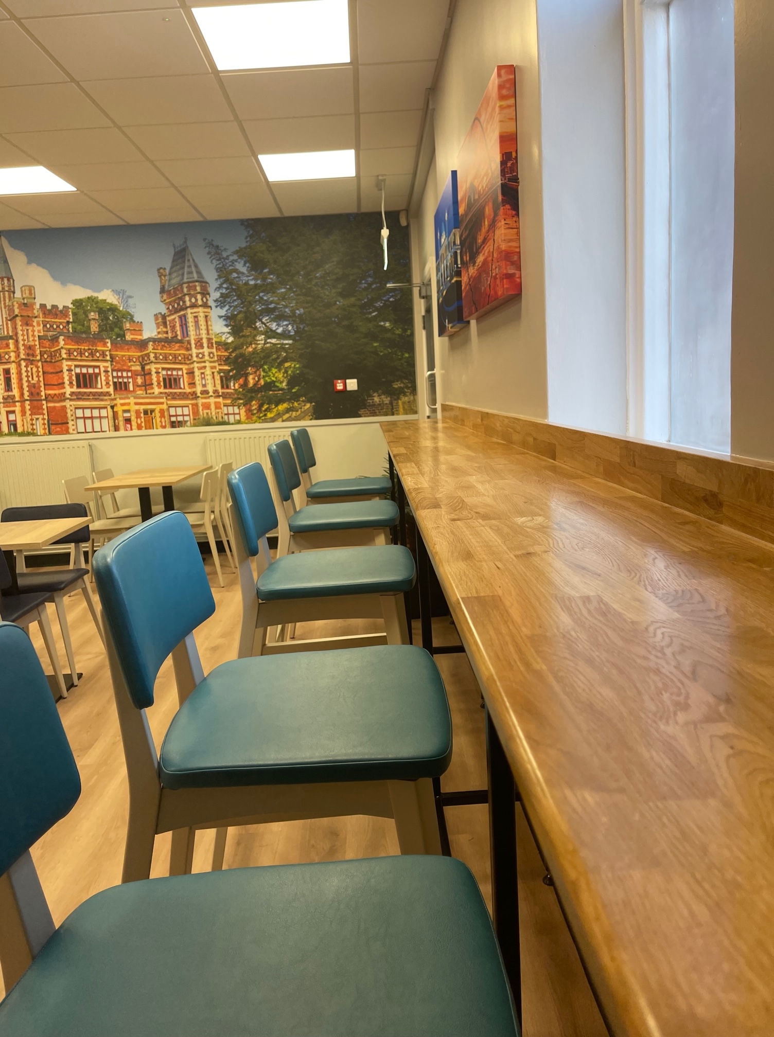 Higher seating at a breakfast bar within the park deli, Bensham Hospital's recently refurbished cafe