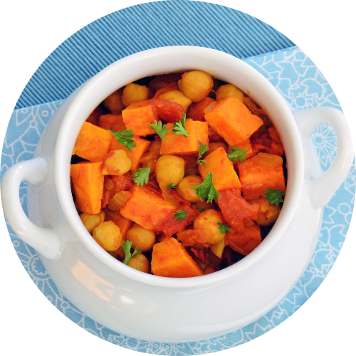 A close up of a sweet potato and chickpea curry in a pot